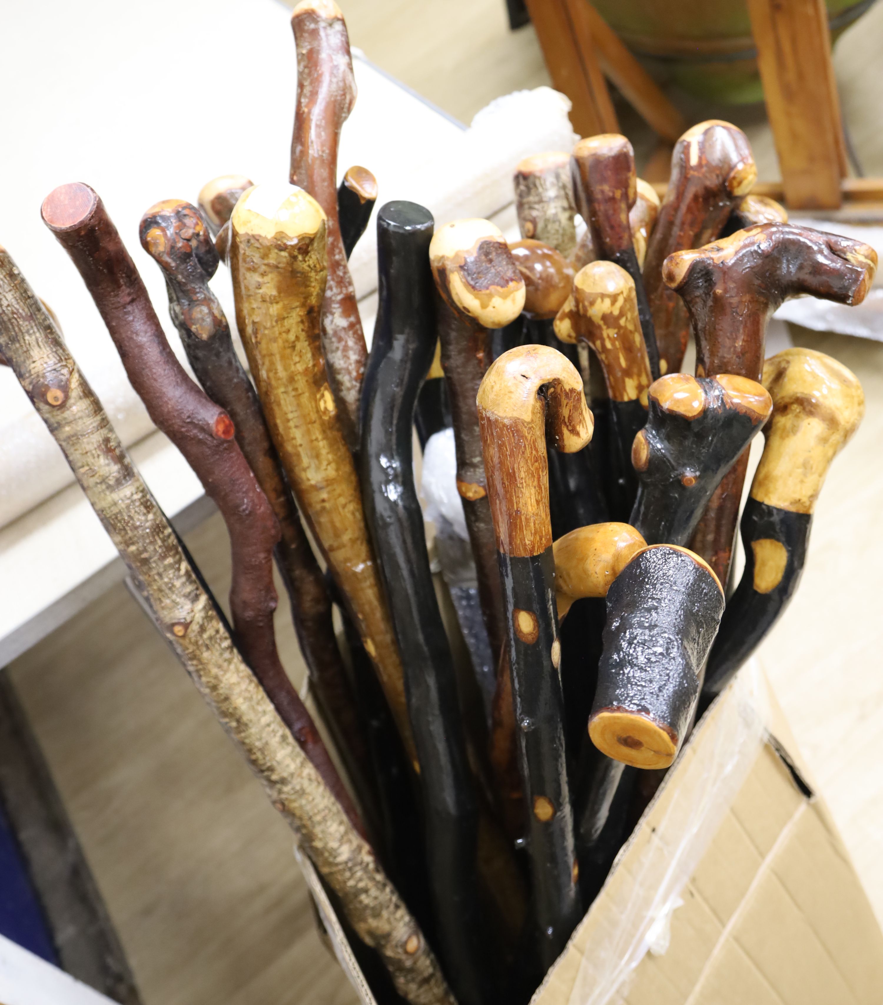 Approximately twenty two assorted provincial wood walking canes
